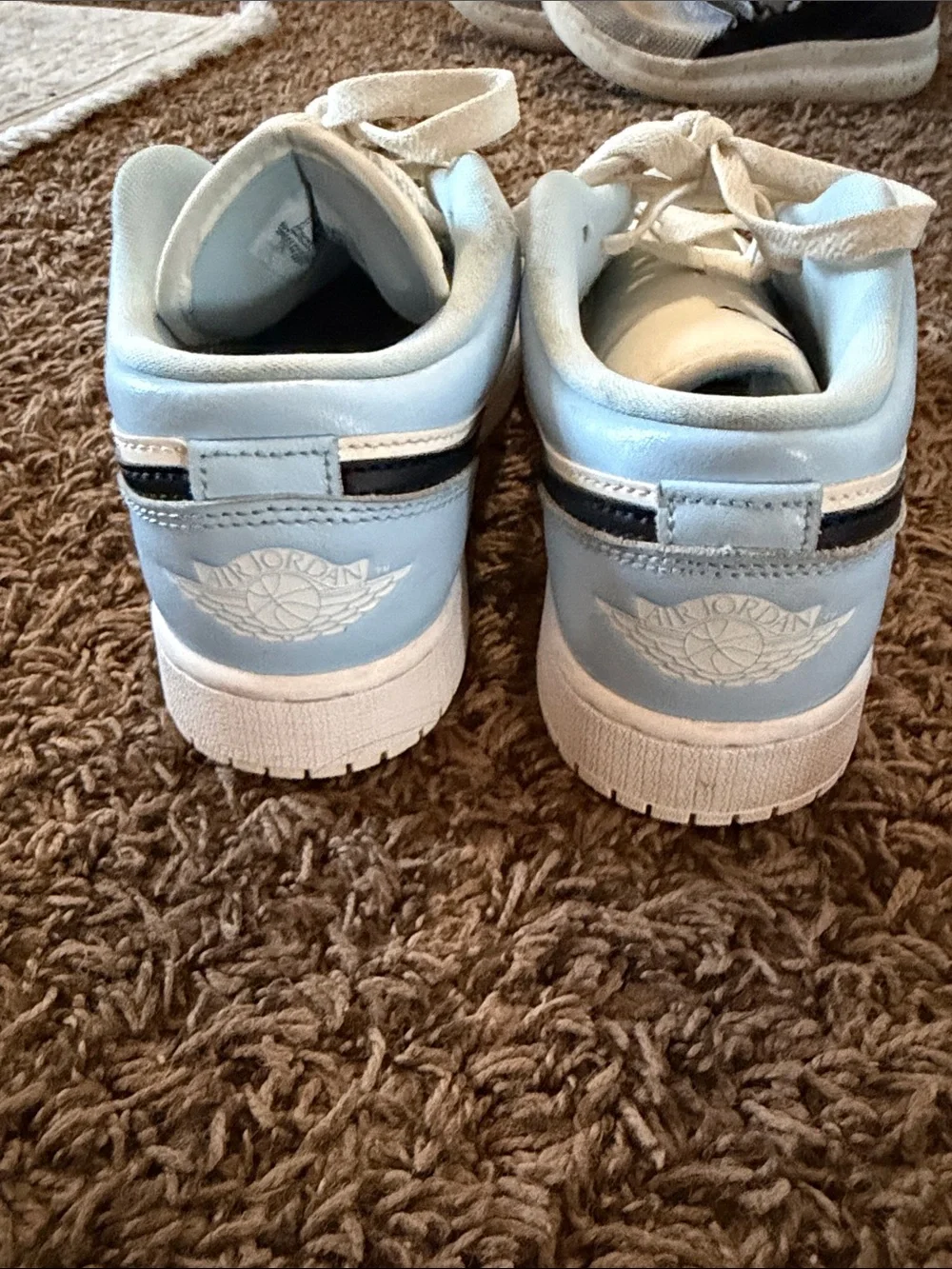 Nike Low-Top Sneakers in White, Light Blue & Black Swoosh